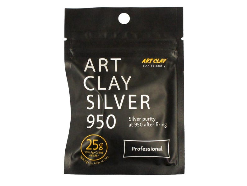 May include: A black rectangular pouch of Art Clay Silver 950, featuring white text that reads Art Clay Silver 950, Professional, and Silver purity at 950 after firing. A yellow circle indicates 25g, 90% Ag+Cu alloy, and 90% Ag+Cu in Clay.