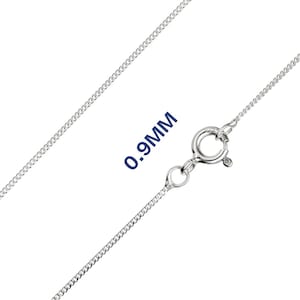 May include: A silver curb chain necklace with a spring ring clasp. The chain is 0.9mm thick. The necklace is shown against a white background.