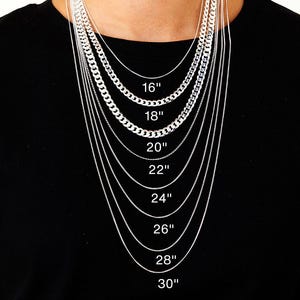 May include: A person wearing a black top, showcasing various silver necklaces of different designs and lengths. The necklaces are labelled with lengths from 16 inches to 30 inches (40.6 cm to 76.2 cm).