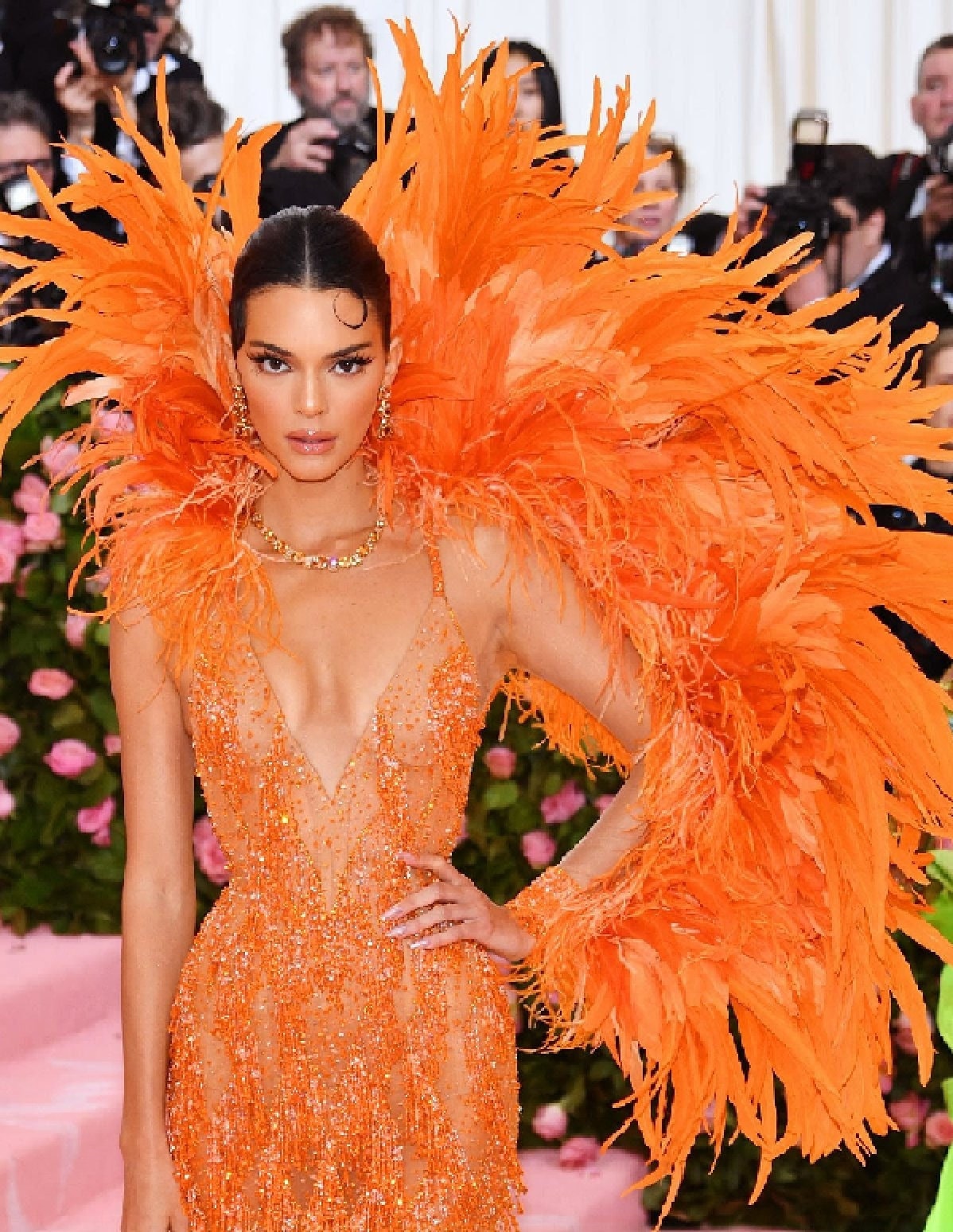 Kylie Jenner Wears Pink and Orange Gown Covered in Feathers