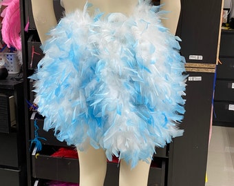May include: A short skirt made of white and light blue feathers. The skirt is fluffy and full, and it would be perfect for a costume or a party.