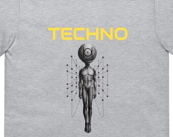 May include: A gray t-shirt with a yellow graphic of a stylized human figure with a circle for a head and the word "TECHNO" above it.