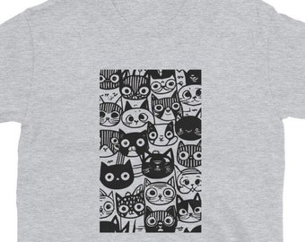 May include: A grey t-shirt with a black and white graphic print of a repeating pattern of cat faces.