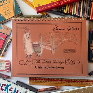 May include: A spiral-bound instructional workbook titled Llama Letters The Letter Bridge A Print to Cursive Journey, featuring a llama illustration and a wooden bridge. A wooden ruler shows measurements in inches alongside vintage crayon boxes.