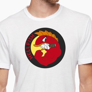 May include: White t-shirt with a red, yellow, and black circular graphic of a cartoon fish with a cigar in its mouth. The text "HELLFISH" is written around the fish in a circle.