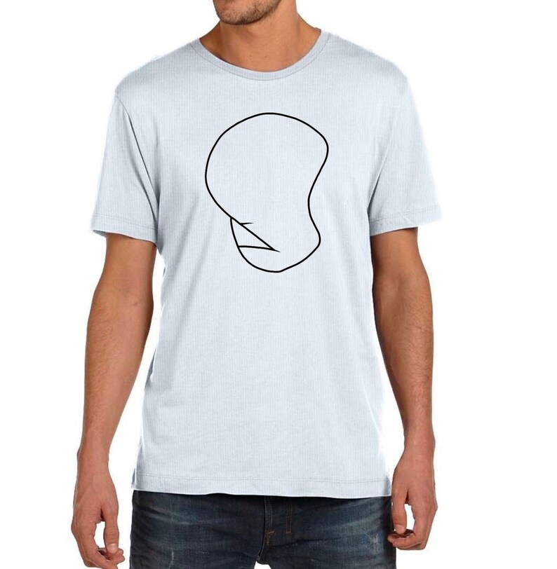 May include: A light blue t-shirt with a black outline of a head on the front.