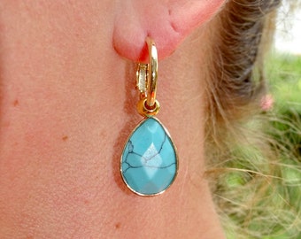 Gold earrings with natural stone pendant