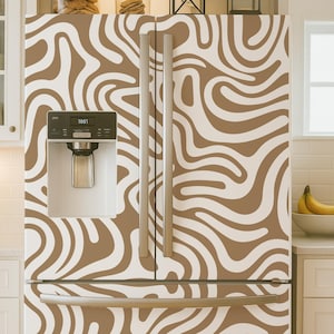 May include: A double-door refrigerator featuring a wrap-around adhesive skin with a wavy, organic pattern in alternating shades of tan and white. The appliance includes a built-in water and ice dispenser on the left door and long vertical handles.