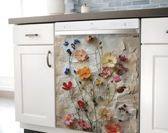 May include: A white dishwasher featuring a decorative front panel with a printed design of various colorful wildflowers, including pink, orange, yellow, and blue blossoms, set against a textured, light beige, crumpled paper background.