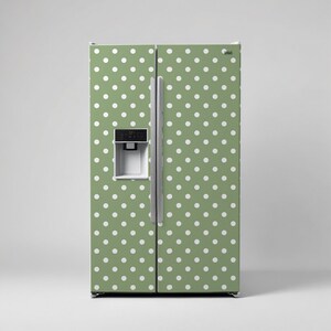 May include: A green refrigerator with white polka dots. The refrigerator has a water dispenser and ice maker.