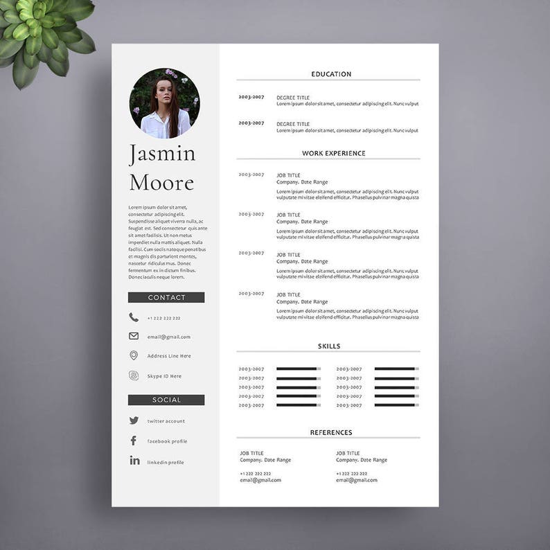 May include: A black and white resume template with a headshot of a woman in a circle at the top. The resume includes sections for education, work experience, skills, and references. The text on the resume is in a simple, modern font.