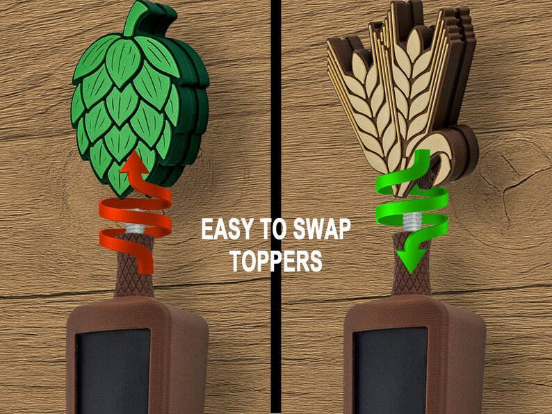 May include: Two beer tap handles with interchangeable toppers. One features a green hop design, the other a wheat and barrel design. The text "EASY TO SWAP TOPPERS" is displayed on a wooden background.