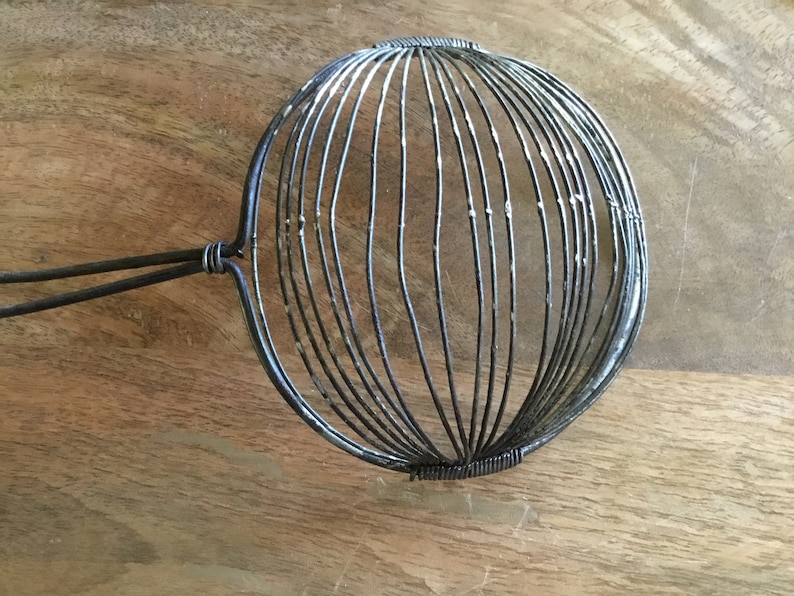 Pair Primitive handled Metal Egg separater strainers