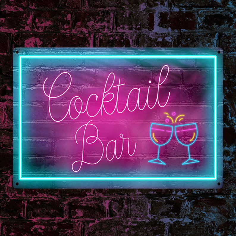 May include: Neon sign with a pink and blue gradient background. The sign says "Cocktail Bar" in pink script with two pink glasses clinking with yellow sparks above them.