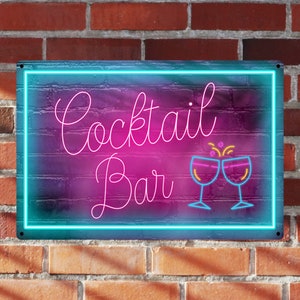 May include: Neon sign with a blue border and a pink background. The sign says "Cocktail Bar" in white cursive lettering with two neon pink glasses clinking together.