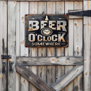 May include: A rectangular metal sign with the words "BEER O'CLOCK SOMEWHERE" in a distressed font. The sign features a clock graphic and a beer bottle illustration. It is mounted on a weathered wooden door.