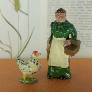 Vintage Britains Farmer&#39;s Wife Cat No 503 (1934) and Britains Hen Cat No 517 (1933)