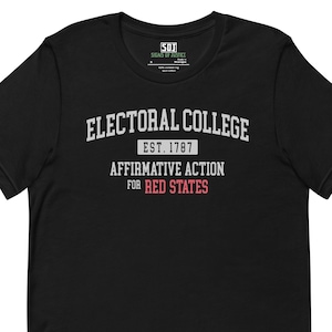 May include: Black t-shirt with the text "ELECTORAL COLLEGE EST. 1787 AFFIRMATIVE ACTION FOR RED STATES" in white and red lettering. The shirt has a crew neck and short sleeves.