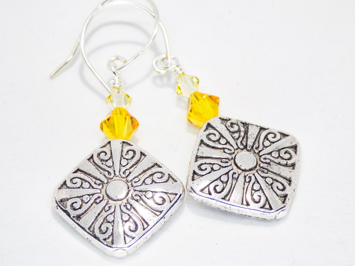 swarovski sun earrings