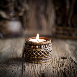 Candle holder with Norse ornaments