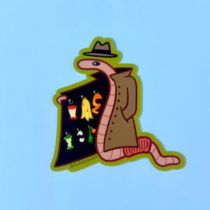 May include: A cartoon worm wearing a brown trench coat and a brown fedora holds a sign with a variety of colorful food scraps. The sign reads "Trash"