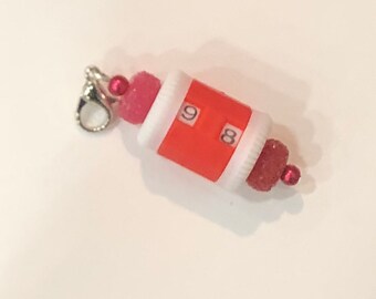 Red beaded row counter with red glass beads
