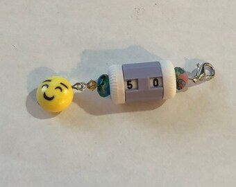 Light Purple beaded row counter with happy face emoji dongle