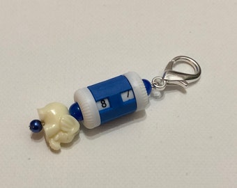 Blue beaded row counter with elephant bead
