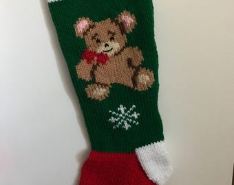 Teddy Bear wearing a bow, with snowflake (GREEN background with RED foot)