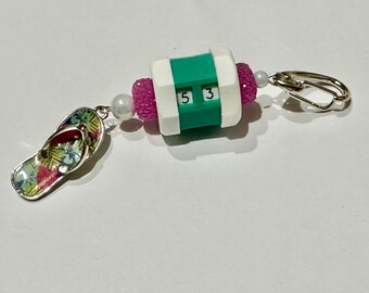 Teal beaded row counter with flip flop token