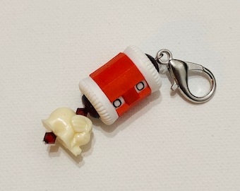 Red beaded row counter with an elephant bead