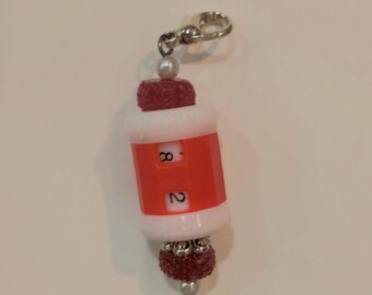 Red beaded row counter with red and silver beads