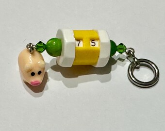 Yellow beaded row counter with piggy charm