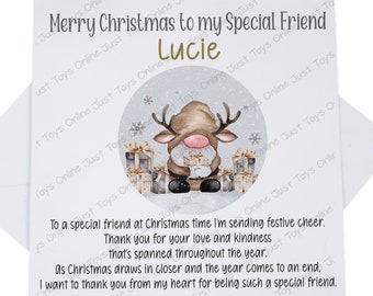 May include: A Christmas card with a festive reindeer illustration and the text "Merry Christmas to my Special Friend Lucie". The card has a white background with a silver glitter effect.