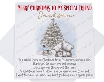 May include: A Christmas card with a snowy scene featuring two teddy bears hugging in front of a decorated Christmas tree. The card reads "Merry Christmas to my special friend Jackson".