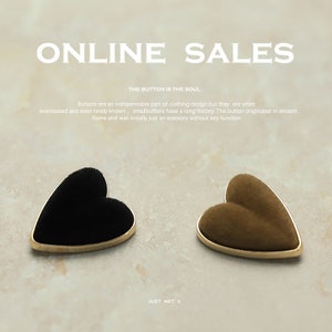 May include: Two heart-shaped buttons with gold trim. One button is black velvet and the other is brown velvet. The text "ONLINE SALES" and "THE BUTTON IS THE SOUL" is at the top of the image. The text "JUST MET U" is at the bottom of the image.