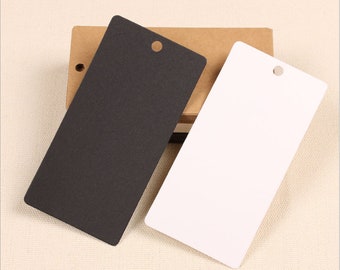 May include: Two blank gift tags with a hole punched in the top. One tag is black and the other is white.