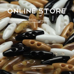 May include: A close-up of a variety of brown, black, and white plastic buttons. The buttons are all in the shape of a boat with two holes. The text "ONLINE STORE" and "BUTTON STUDIO" are visible in the image.