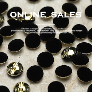 May include: An assortment of black velvet buttons with gold-colored metal backs. The image includes the text "ONLINE SALES" and a description of the buttons' history. These buttons are a clothing design accessory.