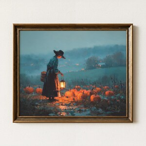 May include: Framed artwork depicting a person in a long dress and hat, carrying a lantern and basket, walking through a pumpkin patch. The scene is set in a field with a soft, atmospheric glow, evoking a sense of autumn.