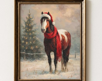 May include: A framed oil painting depicting a brown and white horse wearing a red Santa hat and a long red scarf. The horse stands in a snowy field with a lit Christmas tree in the background under a soft, overcast winter sky.