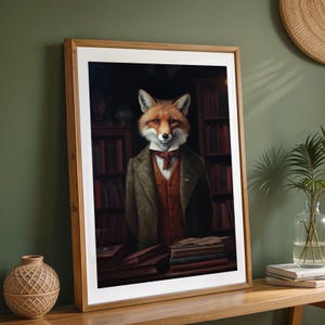 Framed fox print leaning on modern wood console against sage green wall with rattan decor
