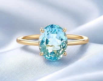 AZZURRO • Ring in 18kt yellow gold with blue topaz