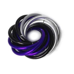 May include: A circular arrangement of interlocking, curved metal rings. The rings are in shades of black, silver, and purple, creating a spiral pattern. The jewelry is set against a white background.