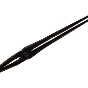 May include: Black metal tongs with a rounded tip. The tongs are used for holding hot metal objects.