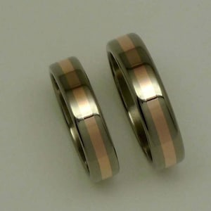 SET of polished titanium/14 carat red gold wedding rings / weddingbands / engagementrings.