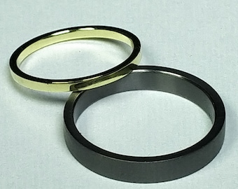 Trauringset aus Tantal und 14K Gold.