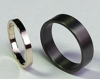 Trauringset aus Tantal und 14K Weißgold.