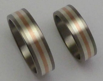 Titanium, 14 carat red gold, silver pair of rings, engagementrings, weddingrings.