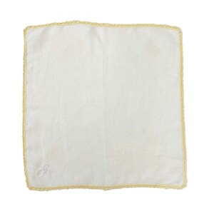 May include: A white handkerchief with a crocheted border and a white embroidered letter "G" in the center.